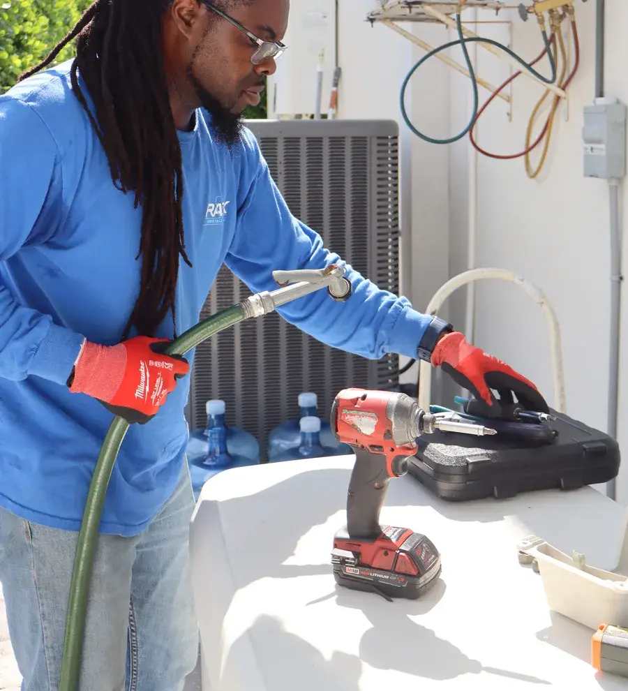 Rack Air technician performing an AC repair in Volusia County